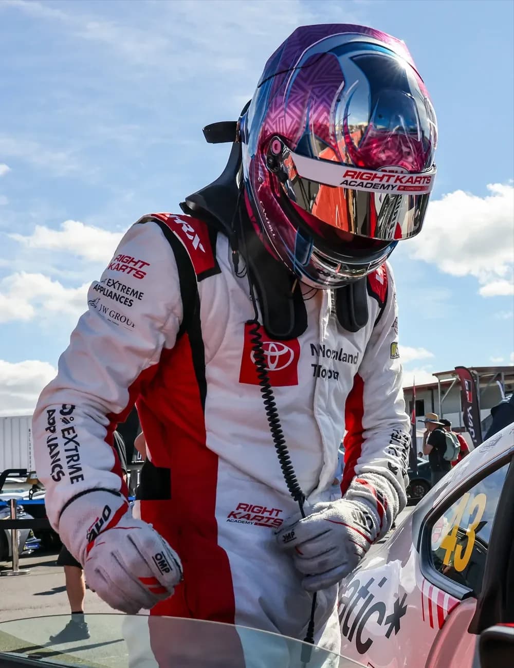 Cameron Hill beside the number 43 Toyota GR86